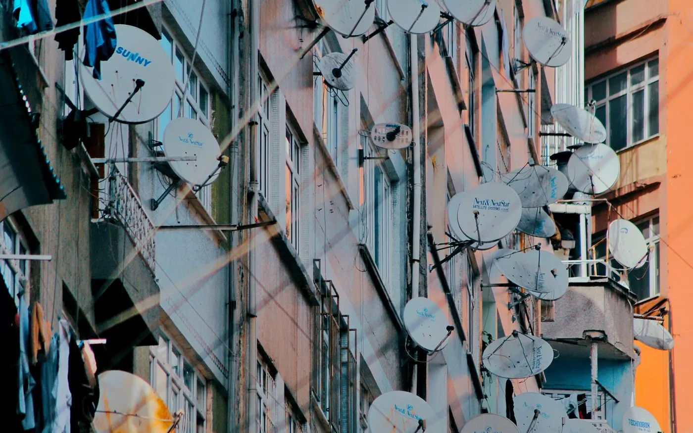 Technician maintaining a communal satellite distribution system